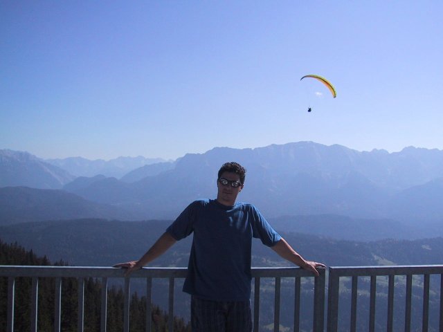 My officemate Corby scoped the scenery and the parasailors from the rail of the mid-way cafe.