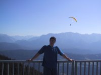 My officemate Corby scoped the scenery and the parasailors from the rail of the mid-way cafe.