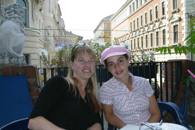 Amara and I eating lunch under the yellow canopies of Hundertwasser Haus.