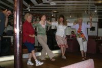 While many of us just sat on deck and soaked up the sun, there were other forms of entertainment aboard ship.  Here Marcia (2nd from the right) learns a Greek dance in one of the indoor lounges.