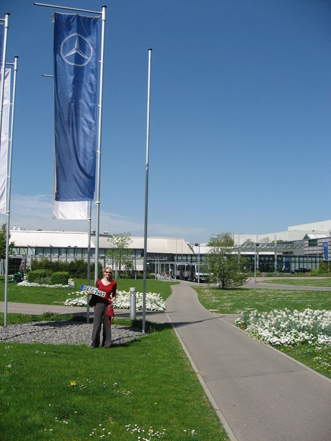 Me, standing outside the Mercedes factory in Sindelfingen (near Stuttgart) with license plates in hand, ready to pickup my new car!