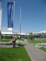 Me, standing outside the Mercedes factory in Sindelfingen (near Stuttgart) with license plates in hand, ready to pickup my new car!