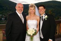 The happy couple with their pastor Ray