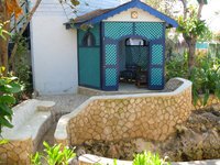 Another view of our terrace, and the stone bench outside facing the huge hole. It was surrounded by a short wall, with one opening and some steps, for the adventurous few who want to jump into the water here and swim the 50 or so meters to one of the ladders on the cliffs.