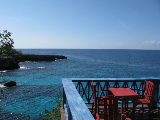 Our regular dinner spot was this red table on the balcony, overlooking the caves, cliffs and light house.