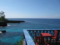Our regular dinner spot was this red table on the balcony, overlooking the caves, cliffs and light house.