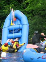 We did participate in this event at least. One boat actually flipped (you can see the oars and bucket floating by here), but it wasn't one from our party.