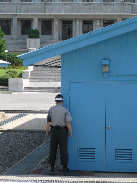 The ROK soldiers stand facing North only partially exposed, just in case battle were to suddenly break out.  As you can see security is taken very seriously here where they are continually face to face with the North Korean military.
