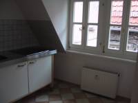 The kitchen, whose windows face the balcony.