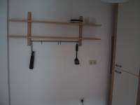 A wall shelf in the kitchen that was included in my purchase.  You can see the 3 plates and spatula I have until my things arrive. ;-)